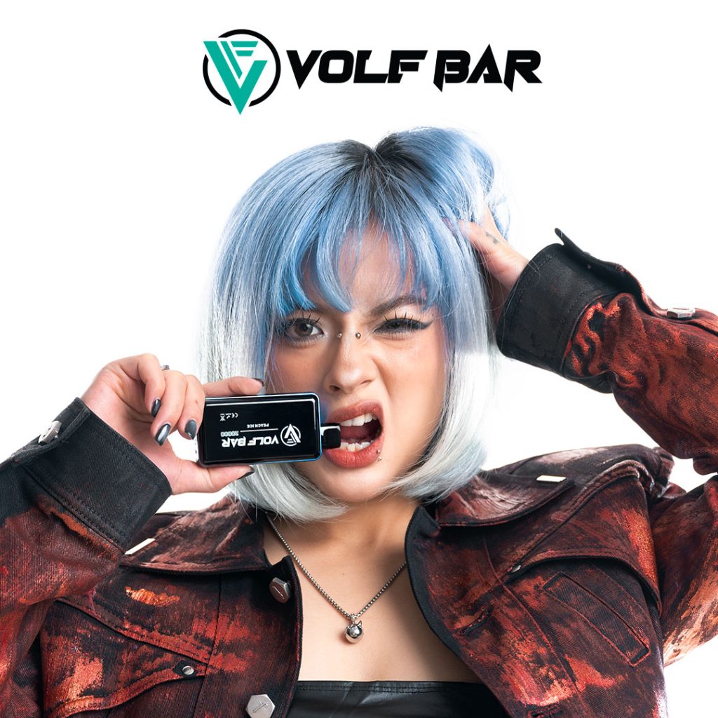 a girl holding a disposable vape